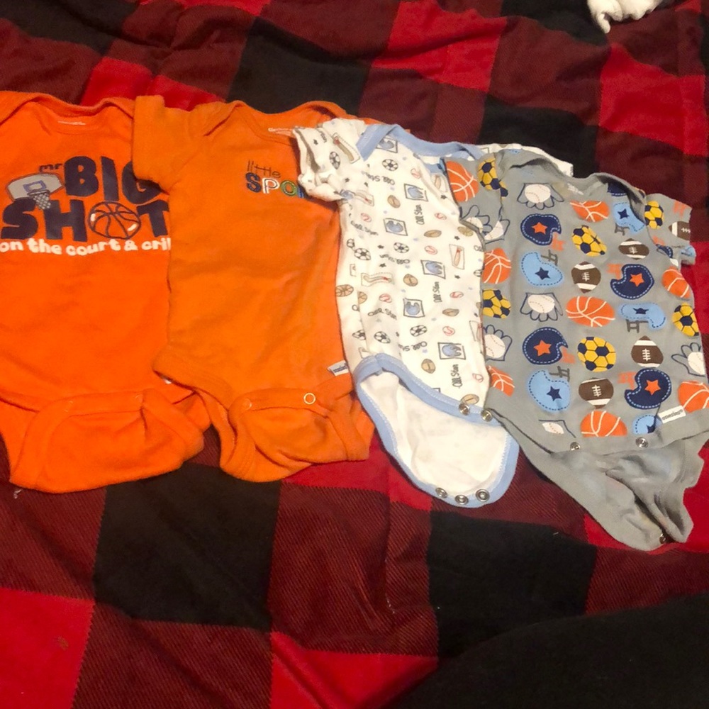 Four boys sports themed onesies.